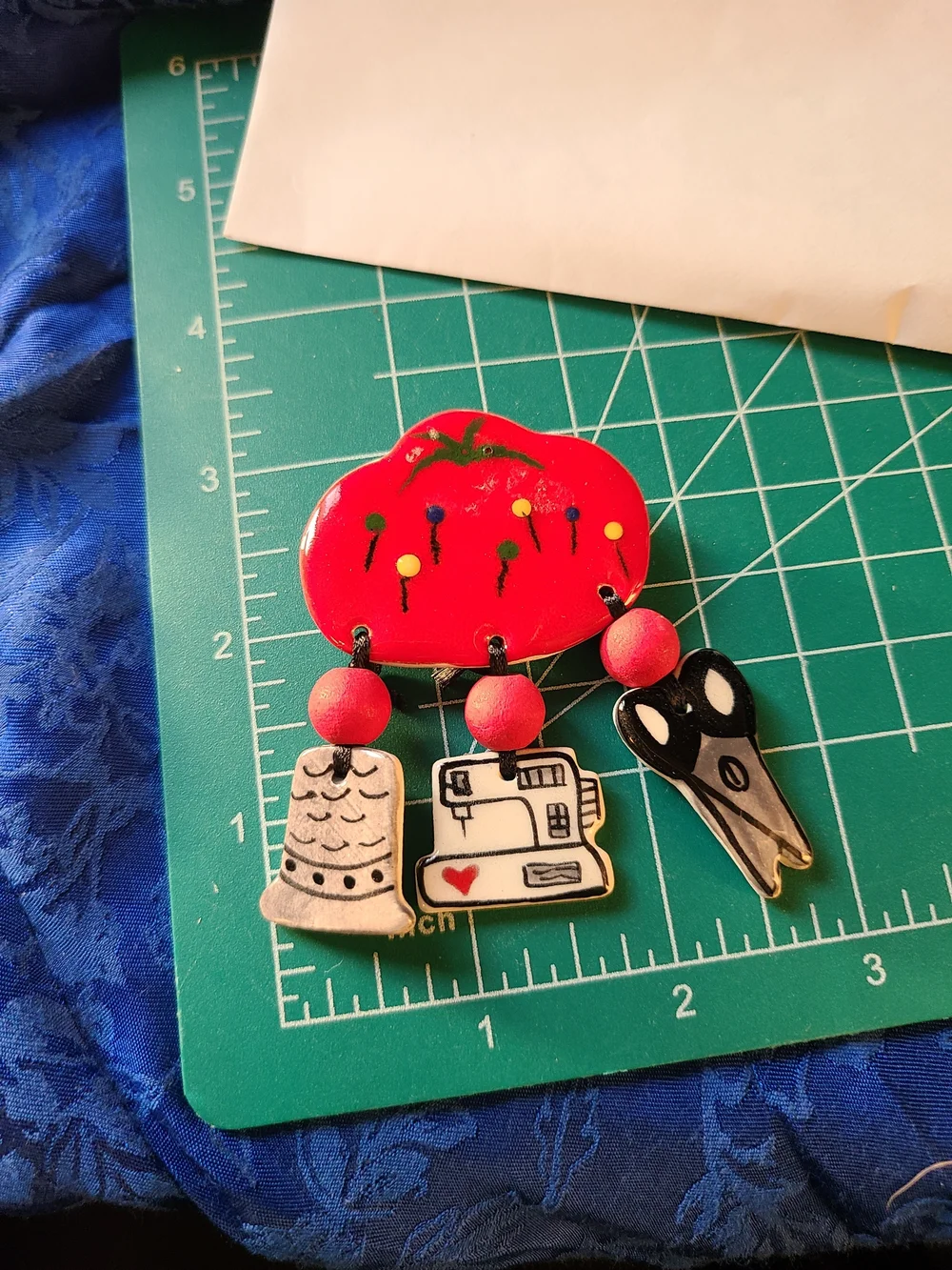Vintage Red Sewing-Themed Brooch with Scissors, Thimble & Sewing Machine